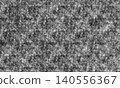 A monochrome grunge texture with a rough, textured feel. 140556367