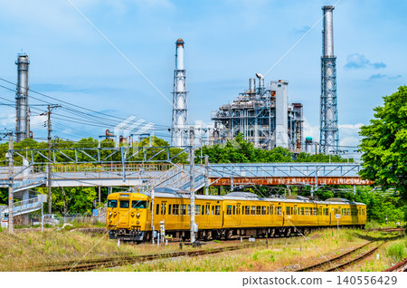 A 115 series train running on the Sanyo Main Line, with an oil refinery in the background, near Kushigahama Station. A 115 series train running on the Sanyo Main Line, with an oil refinery in the background, near Kushigahama Station. 140556429