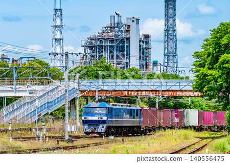 A freight train running on the Sanyo Main Line with an oil refinery complex in the background, near Kushigahama Station. A freight train running on the Sanyo Main Line with an oil refinery complex in the background, near Kushigahama Station. 140556475