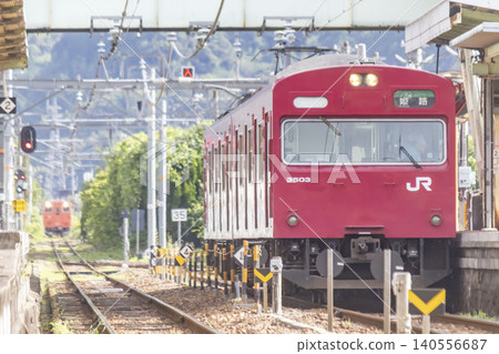 A 103 series train stopped at Teramae Station on the Bantan Line. A 103 series train stopped at Teramae Station on the Bantan Line. 140556687