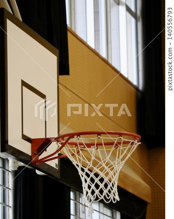 Basketball hoop in a Japanese elementary school gymnasium (vertical composition) | Commercial material for education, school introductions, advertising, web, and document creation. 140556793