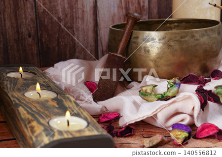 Singing bowl with candles and potpourri for meditation and relaxation Singing bowl with candles and potpourri for meditation and relaxation 140556812