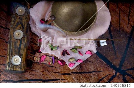 Singing bowl and candles creating a peaceful meditation atmosphere Singing bowl and candles creating a peaceful meditation atmosphere 140556815