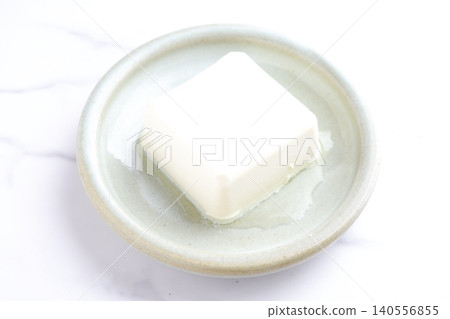 Tofu - When it comes to health foods made from processed soybeans, tofu is the first thing that comes to mind. 140556855