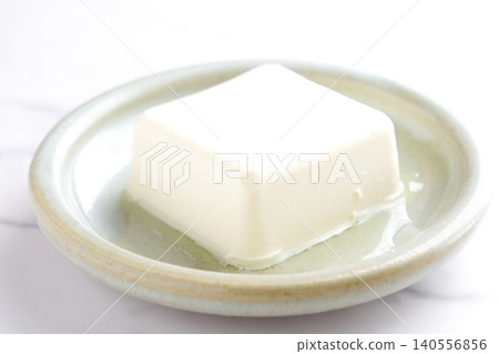 Tofu - When it comes to health foods made from processed soybeans, tofu is the first thing that comes to mind. 140556856