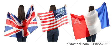 A woman joyfully waves UK, USA, and France flags while exploring vibrant places, on white A woman joyfully waves UK, USA, and France flags while exploring vibrant places, on white 140557052