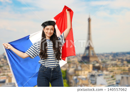 Woman waves flags in Paris. Celebrating culture and travel concept 140557062