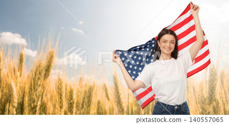 USA 250, Woman waves American flag in golden wheat field. Patriotism and freedom concept 140557065