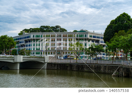 SINGAPORE - JUNE 29, 2025: Wide view of the historic Old Hill Street Police Station featuring its iconic rainbow colored window shutters SINGAPORE - JUNE 29, 2025: Wide view of the historic Old Hill Street Police Station featuring its iconic rainbow colored window shutters 140557538