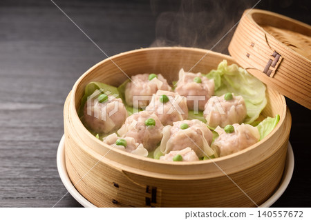 Homemade shumai steamed in a bamboo steamer Homemade shumai steamed in a bamboo steamer 140557672