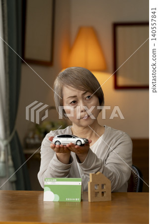 Senior women are worried about their retirement funds due to rising interest rates. 140557841