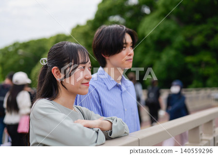 A young couple gazing into the distance A young couple gazing into the distance 140559296