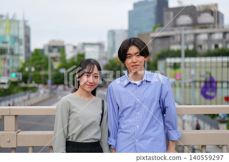 A portrait of a young couple smiling. A portrait of a young couple smiling. 140559297