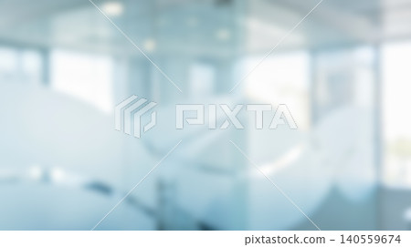 Blurred bright modern office interior featuring glass walls empty corporate hallway reflecting natural daylight creating clean professional working environment background for business presentations 140559674