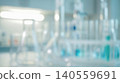 Abstract blurred bright medical science laboratory interior featuring empty glass chemical test tubes reflecting daylight creating clean clinical healthcare research background 140559691
