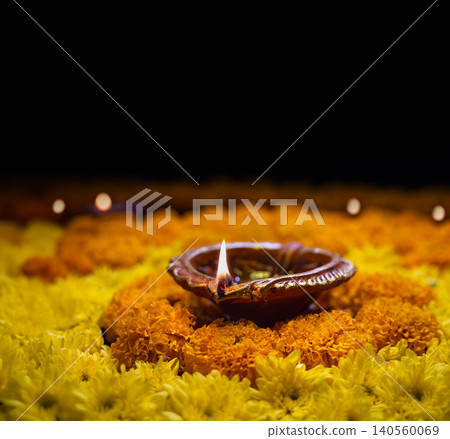 Clay diya lamps lit during diwali celebration, Diwali, or Deepavali, is India's biggest and most important holiday. Clay diya lamps lit during diwali celebration, Diwali, or Deepavali, is India's biggest and most important holiday. 140560069