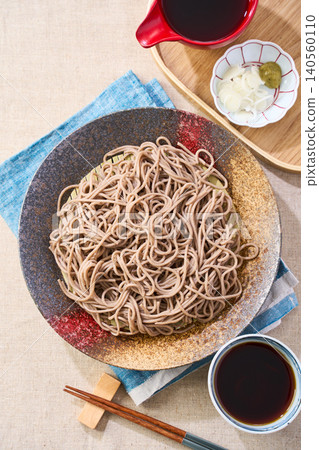 Mori Soba: Cold soba noodles served on a Japanese plate with dipping sauce. Mori Soba: Cold soba noodles served on a Japanese plate with dipping sauce. 140560110