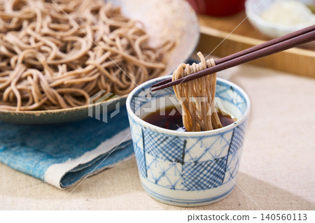 Mori Soba: Cold soba noodles served on a Japanese plate with dipping sauce. Mori Soba: Cold soba noodles served on a Japanese plate with dipping sauce. 140560113
