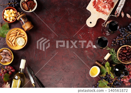 Wine and Charcuterie Corner on Dark Rustic Background 140561872