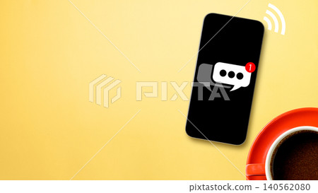 Minimalist flat lay of a black smartphone displaying a chat notification next to a coffee cup and wifi signal graphic on a yellow surface Minimalist flat lay of a black smartphone displaying a chat notification next to a coffee cup and wifi signal graphic on a yellow surface 140562080