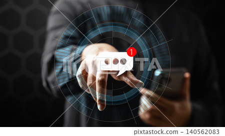 Close up of a man pointing at a glowing digital message notification icon on a virtual screen while holding a smartphone, symbolizing instant messaging and modern communication Close up of a man pointing at a glowing digital message notification icon on a virtual screen while holding a smartphone, symbolizing instant messaging and modern communication 140562083