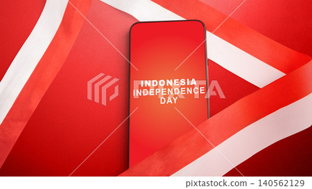 A smartphone with 'Indonesia Independence Day' text on a red screen, wrapped in a red and white ribbon A smartphone with 'Indonesia Independence Day' text on a red screen, wrapped in a red and white ribbon 140562129
