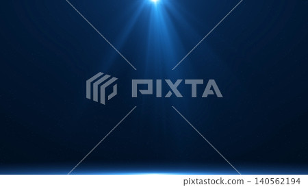 Single overhead spotlight illuminates a dark blue stage with subtle particles and glowing floor edge, perfect for presentations, premium advertising, event visuals, and product display. Single overhead spotlight illuminates a dark blue stage with subtle particles and glowing floor edge, perfect for presentations, premium advertising, event visuals, and product display. 140562194