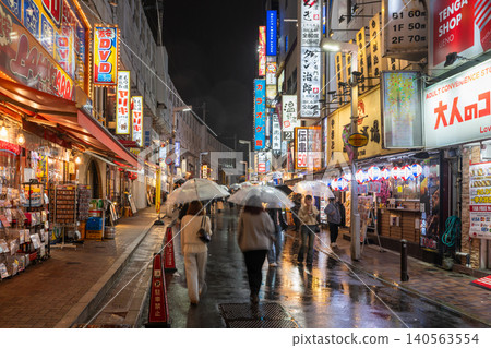 A bar district under the railway tracks in front of Ueno Station in the rain A bar district under the railway tracks in front of Ueno Station in the rain 140563554