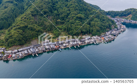 A row of boathouses along Ine Bay 140563705