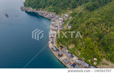 A row of boathouses along the coastline of Ine Bay A row of boathouses along the coastline of Ine Bay 140563707