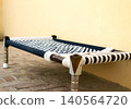 Traditional Indian Woven Bed Charpai on Paved Ground 140564720