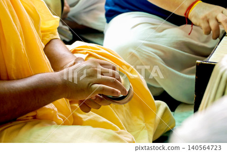Indian Devotee Playing Traditional Cymbals During Kirtan at prem mandir vrindavan Indian Devotee Playing Traditional Cymbals During Kirtan at prem mandir vrindavan 140564723
