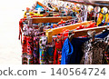 Colorful Women Clothes Hanging on Rack in Boutique Store 140564724