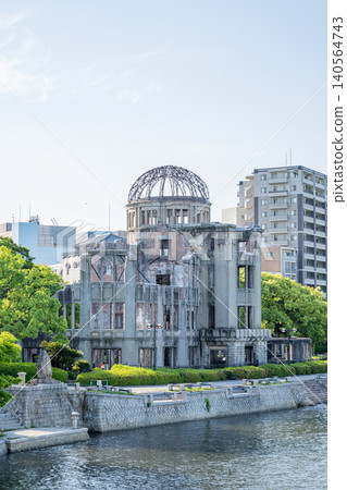 A cityscape along the river overlooking Hiroshima Peace Memorial Park and the Atomic Bomb Dome. A cityscape along the river overlooking Hiroshima Peace Memorial Park and the Atomic Bomb Dome. 140564743