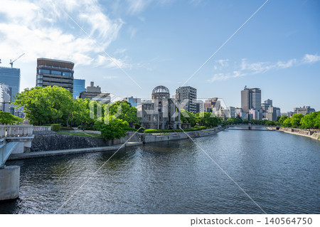 A cityscape along the river overlooking Hiroshima Peace Memorial Park and the Atomic Bomb Dome. A cityscape along the river overlooking Hiroshima Peace Memorial Park and the Atomic Bomb Dome. 140564750