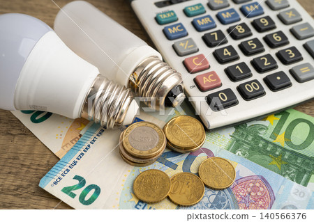 Cost of electric utilities with light bulb for payment. Cost of electric utilities with light bulb for payment. 140566376