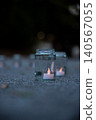 Candlelight in a glass bottle and a nighttime landscape 140567055