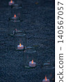 A night road lined with candlelight 140567057