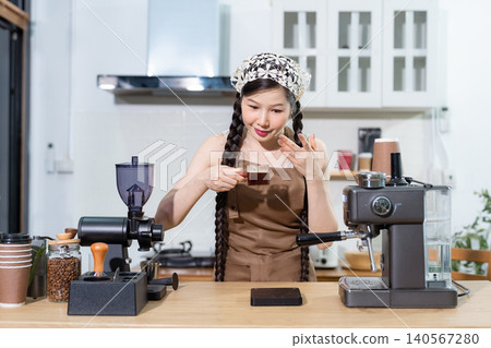 Young barista making coffee, coffee preparation service concept. Young barista making coffee, coffee preparation service concept. 140567280