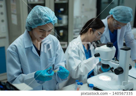 Chemist scientist or doctor working in research laboratory, medical analysis, documents, scientific study. Chemist scientist or doctor working in research laboratory, medical analysis, documents, scientific study. 140567335