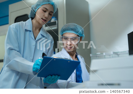 Chemist scientist or doctor working in research laboratory, medical analysis, documents, scientific study. Chemist scientist or doctor working in research laboratory, medical analysis, documents, scientific study. 140567340