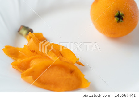 Background material featuring irregularly shaped, organic, fully ripened loquats (peeled). Background material featuring irregularly shaped, organic, fully ripened loquats (peeled). 140567441
