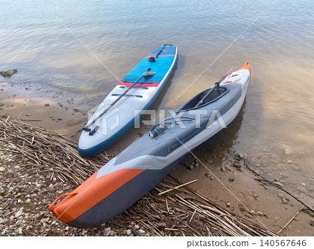 Two surfboards are laying on the beach Two surfboards are laying on the beach 140567646