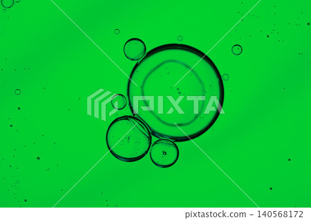 Minimalist macro photography of clear circular liquid droplets over a vibrant solid color Minimalist macro photography of clear circular liquid droplets over a vibrant solid color 140568172