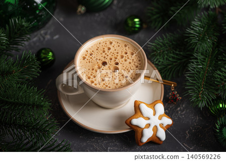 Coffee mug with gingerbread snowflake cookie and christmas decorations Coffee mug with gingerbread snowflake cookie and christmas decorations 140569226