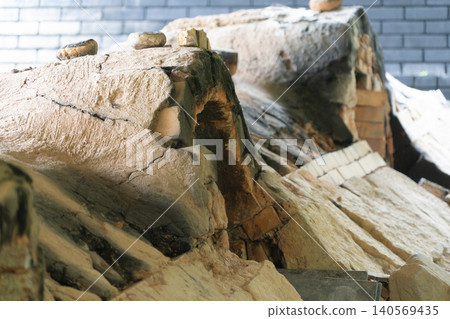 A traditional climbing kiln with stacks of firewood and a pottery workshop. A traditional climbing kiln with stacks of firewood and a pottery workshop. 140569435