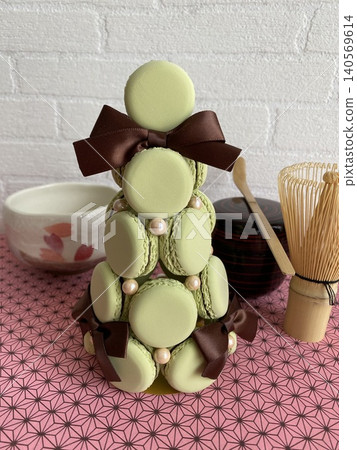 A modern Japanese space featuring a matcha-colored fake macaron tower and tea ceremony utensils. A modern Japanese space featuring a matcha-colored fake macaron tower and tea ceremony utensils. 140569614