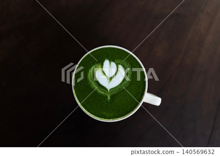 Matcha latte on dark grunge wooden surface Matcha latte on dark grunge wooden surface 140569632