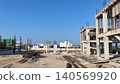 Modern residential building under construction in Cyprus with reinforced concrete framework, highlighting real estate development, urban expansion, and investment growth in the Mediterranean. 140569920