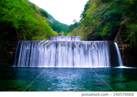 A sediment control dam surrounded by greenery A sediment control dam surrounded by greenery 140570008